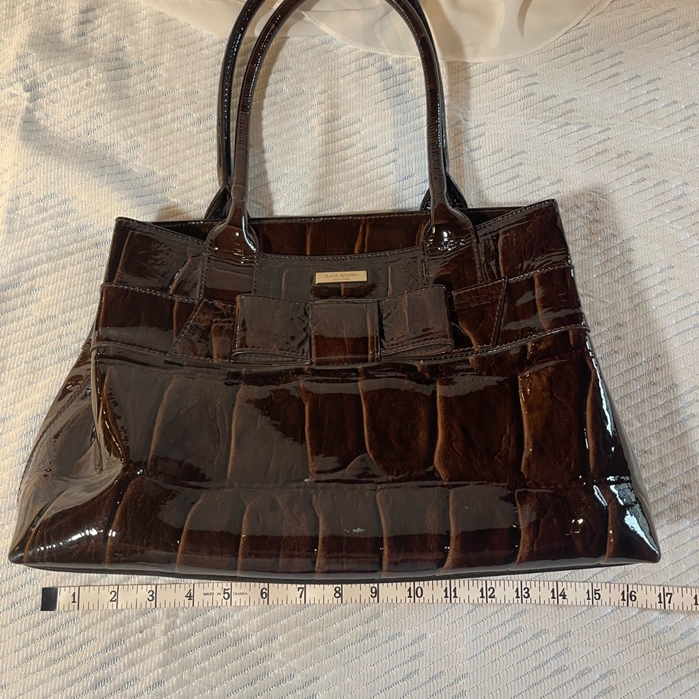Kate Spade Chocolate Brown Patent Leather Faux Reptile Handbag with bow